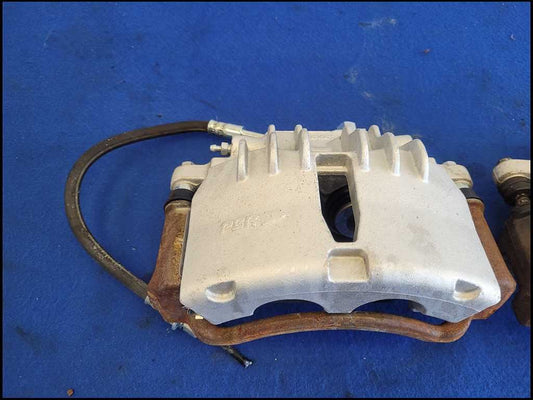 1999-2004 Ford Mustang GT 4.6L Front Pair Brake Calipers Pads Hoses 2640